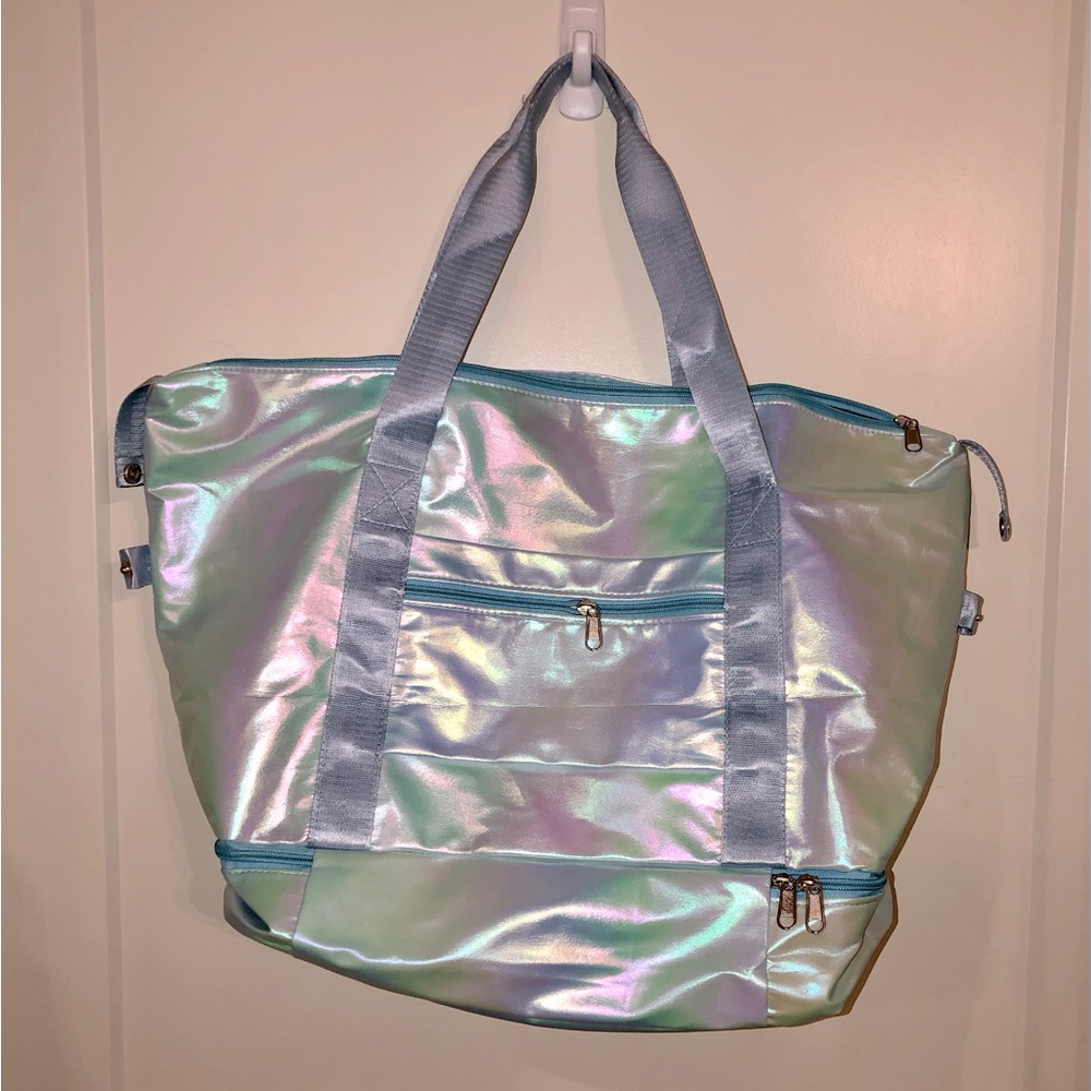 Tote bag with separate zipped bottom compartment.